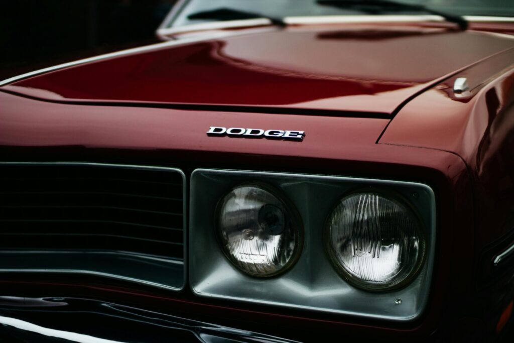 Detailed close-up of a vintage Dodge car front with chrome headlights in Curitiba, Brazil.